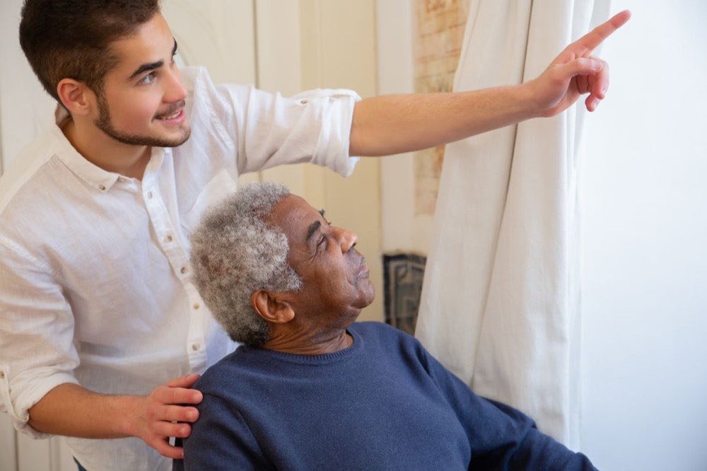 Hands of a caregiver offering companionship