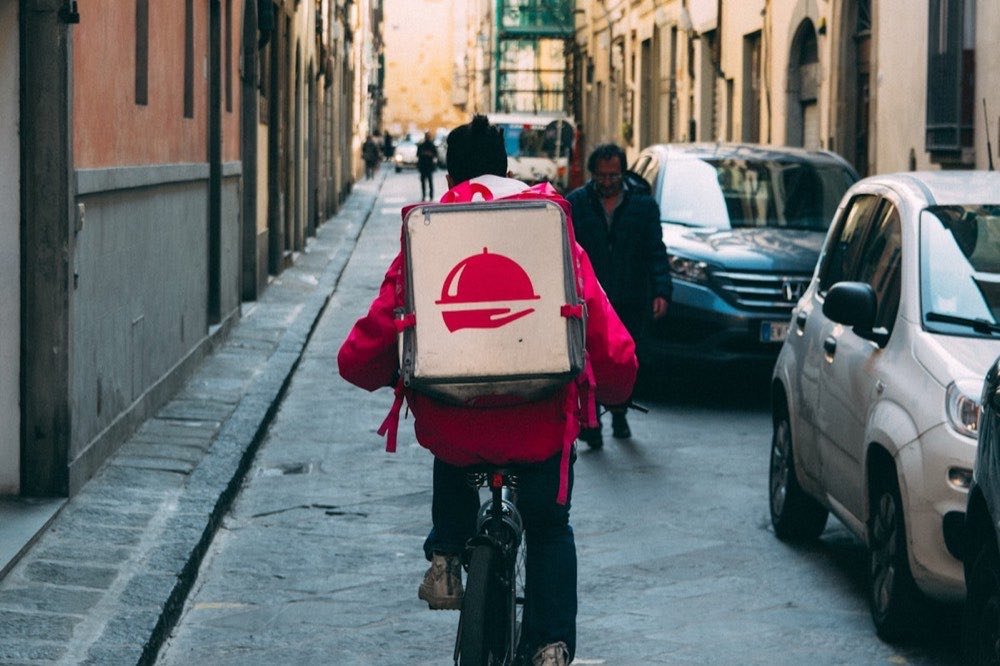 Package being carried for delivery